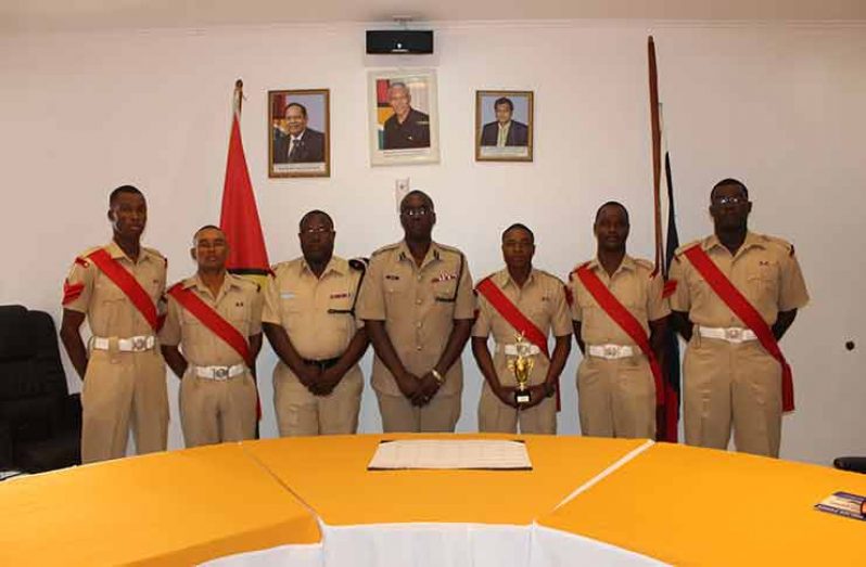 Finance Officer and Acting Assistant Commissioner of Operations, Assistant Commissioner Nigel Hoppie (centre) and Deputy Superintendent Guy Nurse with graduating ranks of Drill Course 2018-01