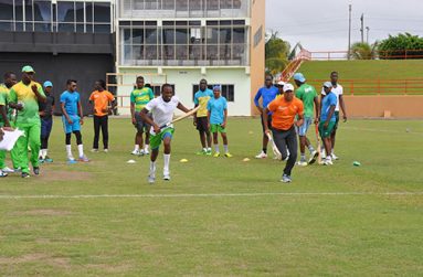Ok I have the record, let’s go guys! Coach Clive Grimmond (left forefront) keeps the record as Trevon Griffith (left) and Jonathan Foo (right) go through their sprints as the rest of the players including head coach Esuan Crandon look on.
