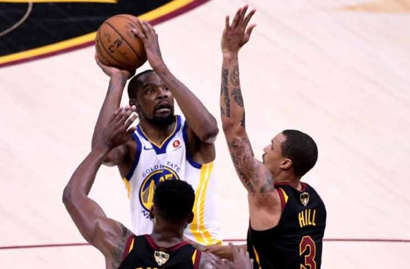 Golden State Warriors forward Kevin Durant (35) shoots the ball against Cleveland Cavaliers guard George Hill (3) during the third quarter in game three of the 2018 NBA Finals at Quicken Loans Arena. (Kyle Terada-USA TODAY Sports)