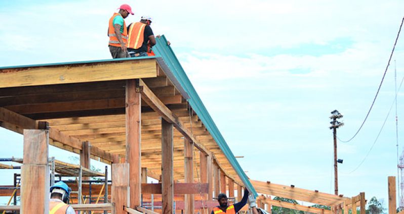 Contractors brave the weather to complete works at the D’urban Park Development Project. [Samuel Maughn photo]