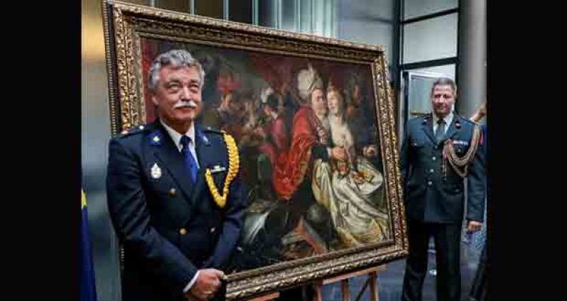 Security guards are seen during a ceremony to mark the return of paintings that were stolen from the Netherlands' Westfries Museum in 2005 and discovered in Ukraine earlier in 2016, in Kiev, Ukraine, September 16, 2016. REUTERS/Gleb Garanich