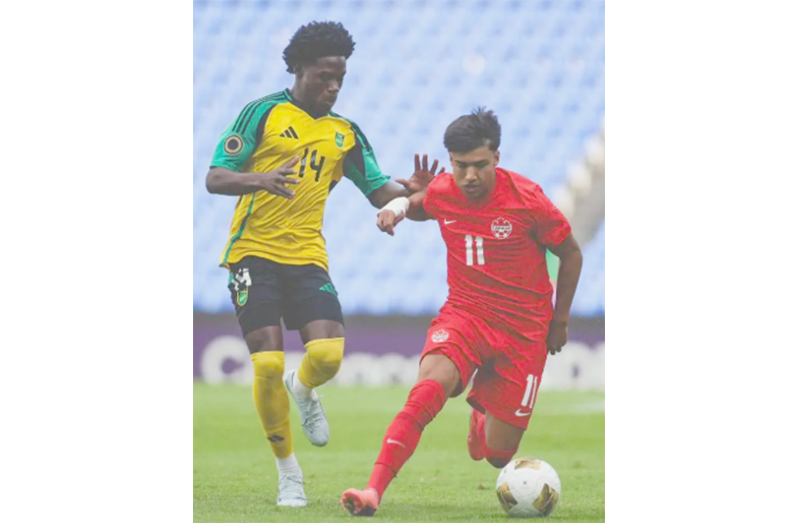 Jamaica’s Duwayne Burgher (left) tracks the run of Canada’s Lucas Lima during their CONCACAF U-20 Men’s Championship quarter-final game