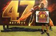 Dwayne Bravo poses with a picture of his retired number 47 jersey during the ceremony on Saturday.