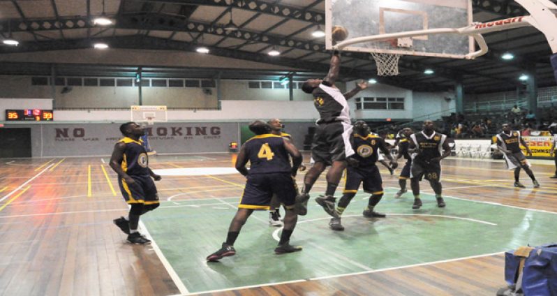 Retrieve Raiders' forward Dwayne 'Brown Sugar' Roberts goes hard to the basket in the third quarter against the TGH Pacesetters.