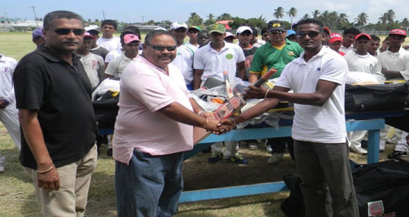 GCB president Drubahadur hands over kit to Mustafaa Azimulla of Better Hope. Also in photo is GCB secretary Anand Sanasie (L).