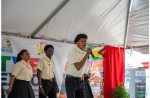 Levi Pereira and his backup singers, fellow students of Leonora Technical and Vocational Training Centre, on stage during their performance of “One Guyana”, which attendees received well, on September 15, 2026, at the opening of the TVET Fair and Expo 2026 (Elton John photos )