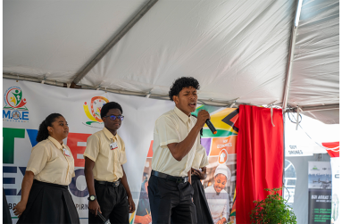 Levi Pereira and his backup singers, fellow students of Leonora Technical and Vocational Training Centre, on stage during their performance of “One Guyana”, which attendees received well, on September 15, 2026, at the opening of the TVET Fair and Expo 2026 (Elton John photos )