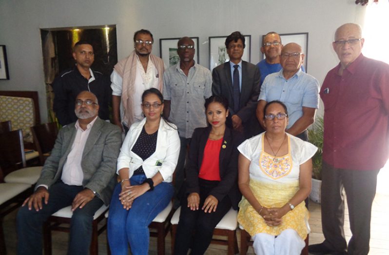 ERC Commissioners pose with representatives of the Indo-Guyanese Community
