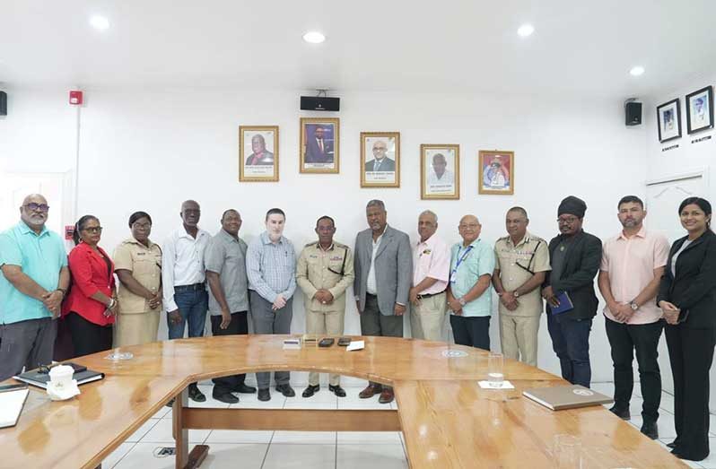 Commissioner of Police, Mr. Clifton Hicken (centre), flanked by Shaikh Moeenul Hack, Chairman of the ERC and commissioners along with senior GPF officers at the Eve Leary Police Headquarters