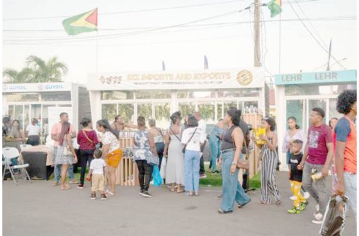 Patrons explore exhibition booths at GuyExpo 2024