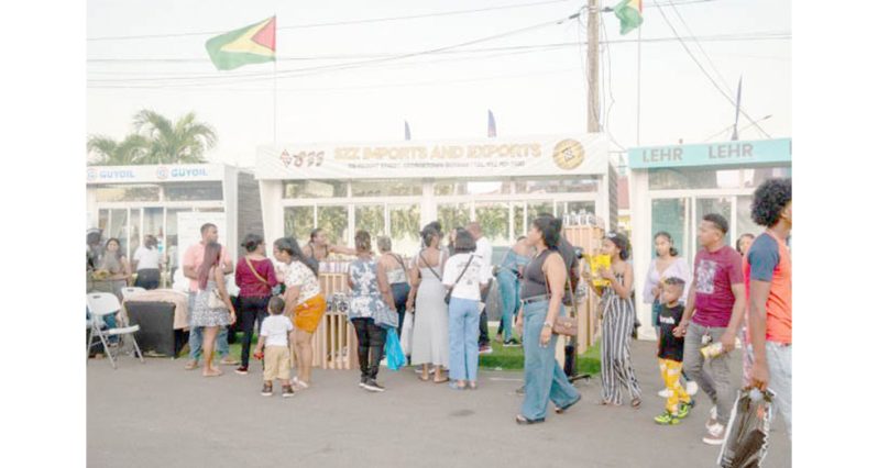 Patrons explore exhibition booths at GuyExpo 2024