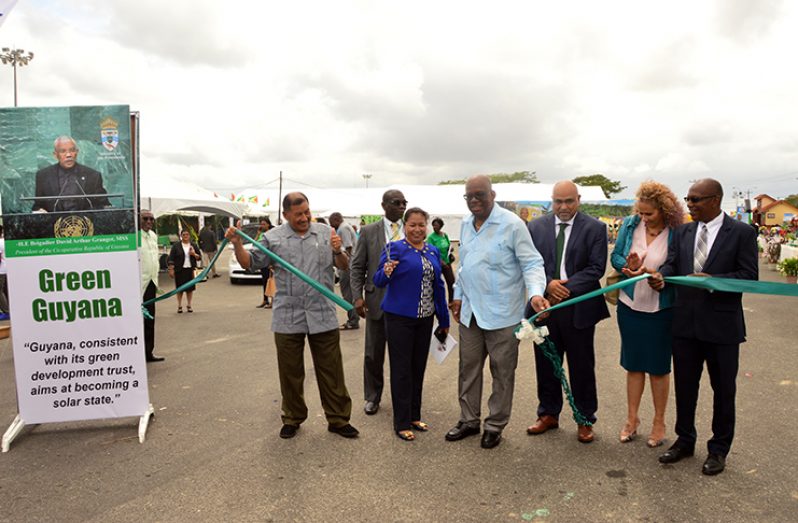 The Green Guyana Expo was opened by Minister of Finance Winston Jordan and Minister of Public Affairs, Dawn Hastings who cut the ceremonial ribbon alongside Minister of Indigenous Peoples’ Affairs Sydney Allicock; IAST Chairman, Dr. Suresh Narine; IDB Country Representative, Sophie Makonnen, and chairman of the Expo’s Planning Committee Eric Phillips

Minister of Indigenous Peoples’ Affairs, Sydney Allicock, Minister of Public Affairs, Dawn Hastings-Williams, Minister of Finance, Winston Jordan, Chairman of IAST, Dr. Suresh Narine, IDB Country Representative, Sophie Makonnen, and Chairman of the Expo’s Planning Committee Eric Phillips.
Minister of Indigenous Peoples’ Affairs, Sydney Allicock, Minister of Public Affairs, Dawn Hastings-Williams, Minister of Finance, Winston Jordan, Chairman of IAST, Dr. Suresh Narine, IDB Country Representative, Sophie Makonnen, and Chairman of the Expo’s Planning Committee Eric Phillips.
