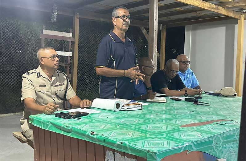 Seated at left, Divisional Commander, Assistant Commissioner Khali Pareshram, listens to Chairman of the Enmore CPG, Jailall Deodass and other representatives during his interaction at the community meeting held at the Enmore Community Policing Group’s Office on Tuesday