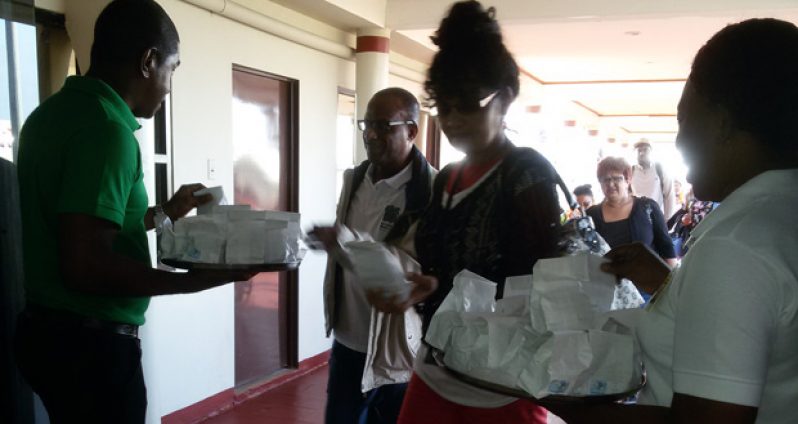 Easter kites and crossbuns being distributed to an arriving passenger