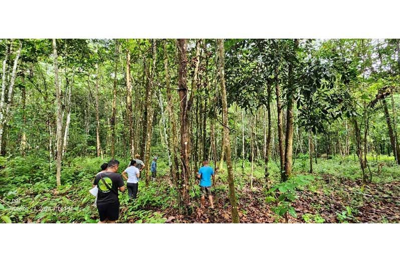 Villagers and visiting team from the GTA, in the process of identifying a suitable location for the Eco- Lodges