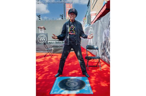 An elated Eddy Grant stands near his plaque shortly after it was unveiled to officially welcome him into The Music Walk of Fame (Gavin Mills photo)