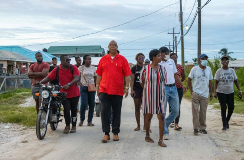 Minister Edghill conducted a walkabout in the community, assessing the condition of the roads (DPI)
