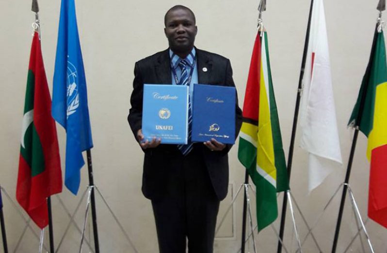 Senior Police Superintendent Edmond Cooper displaying his certificates