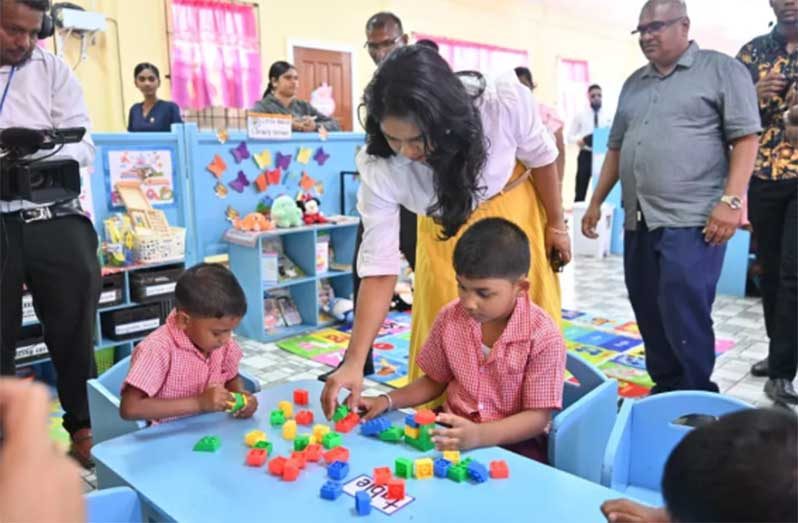 Minister of Education Sonia Parag engages a student at the new Mibicuri Nursery School