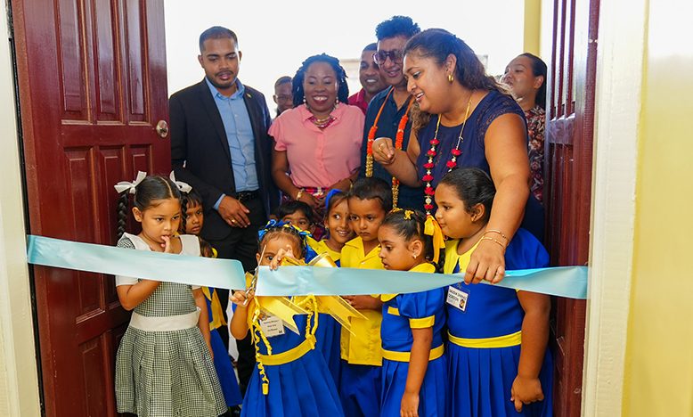 The ceremonial cutting of the ribbon to officially commission the school being done by pupils in the company of the Minister of Education, Priya Manickchand; Attorney General and Minister of Legal Affairs, Anil Nandlall, S.C.; Regional Chairman, Daniel Seeram, and Regional Education Officer, Stembiso Grant