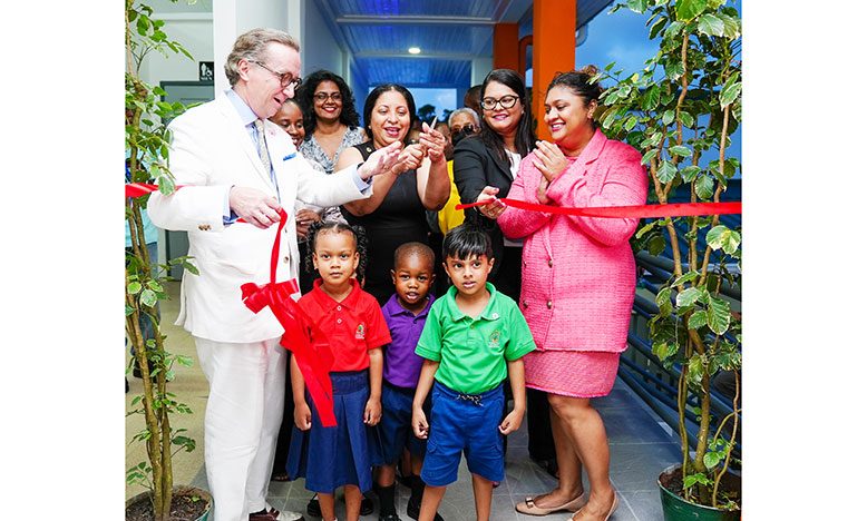 Education Minister, Priya Manickchand; UNICEF Representative, Nicholas Pron; Vice Chancellor of the University of Guyana, Professor Paloma Mohamed, and other officials together with young learners cut the ceremonial ribbon to officially commission the $161M Early Childhood Centre of Excellence