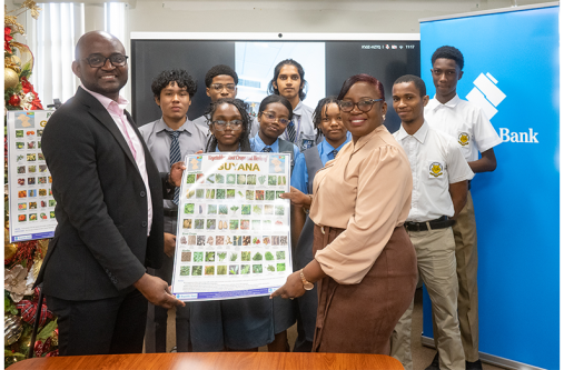 Students from St. Stanislaus College and Brickdam Secondary, Dr Kofi Dalrymple, Presidential Adviser to the Ministry of Education receive the charts from Jonelle Dummett, Manager - Marketing & Communications, Republic Bank (Guyana) Limited