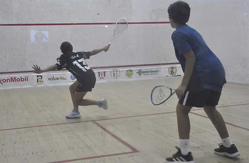 Ella Fernandes (left) executes an elegant backhand shot to beat Francis Thomas 3-0 (Sean Devers photo)