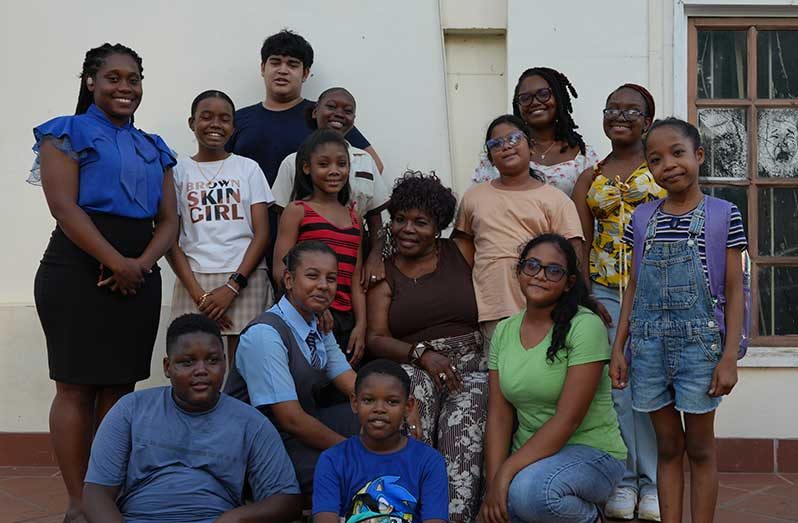 Ms. Simone Dowding, along with the participants of this year’s workshop, and Emerge 13 (Sachin Persaud photo)