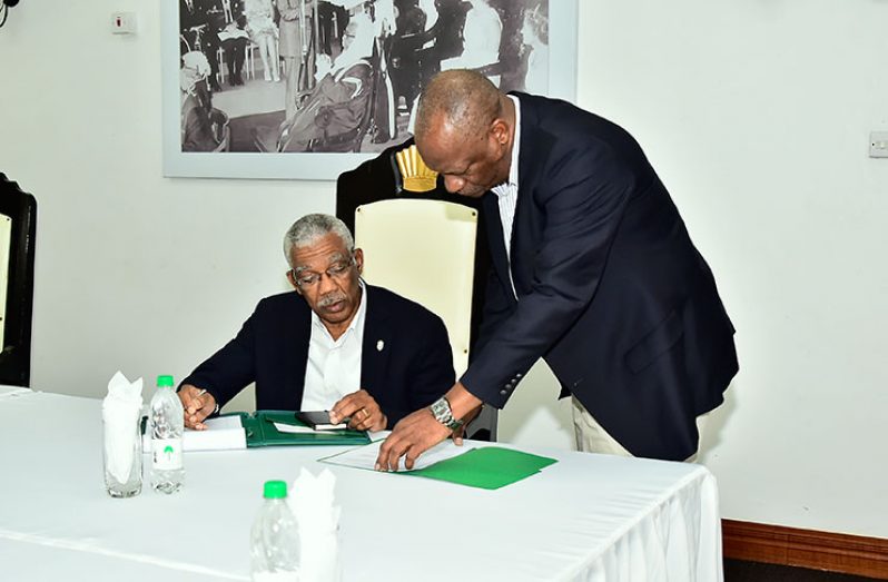 President David Granger and Minister of State,
Mr. Joseph Harmon, in discussion prior to the
commencement of the meeting
