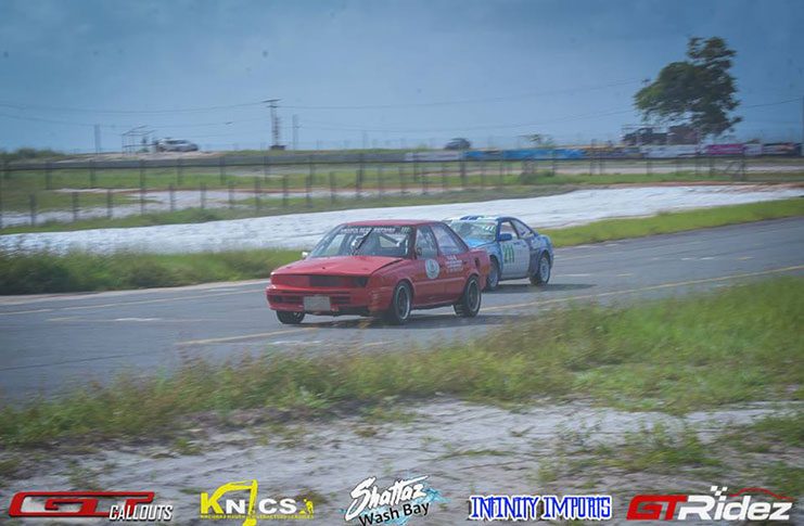In this GTRidez photo, Sean Bacchus (red car) and Adrian Fernandes battle for the lead of the Endurance Championship.