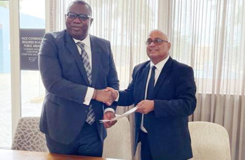 GOGEC President, Maniram Prashad (right), and the Chief Executive Officer (CEO) of the Ghanaian Petroleum Commission, Egbert Faibille Jnr. (DPI photo)