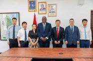 Prime Minister (PM), Brigadier (Ret’d) Mark Phillips flanked by the delegation, led by Mr. Guolai Zhang, President of POWERCHINA Americas