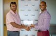 LGC captain Ayube Subhan (left) receives the sponsorship cheque from Lindon Henry, Marketing Manager- Mobile at ENet