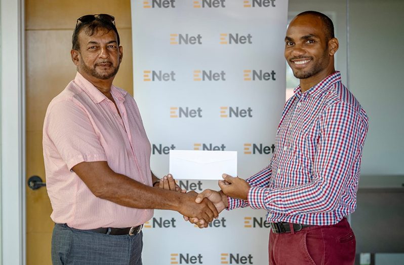 LGC captain Ayube Subhan (left) receives the sponsorship cheque from Lindon Henry, Marketing Manager- Mobile at ENet