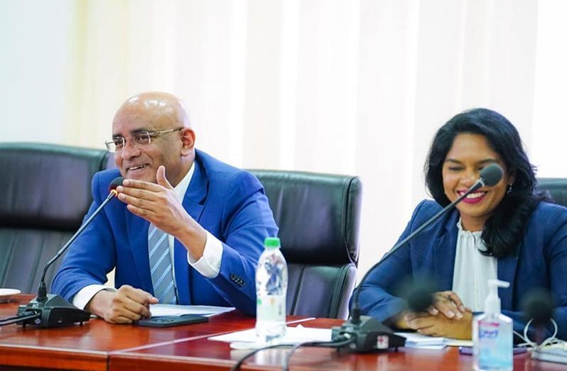 Vice-President, Dr. Bharrat Jagdeo and Public Service Minister Sonia Parag engaging persons who completed their government scholarships