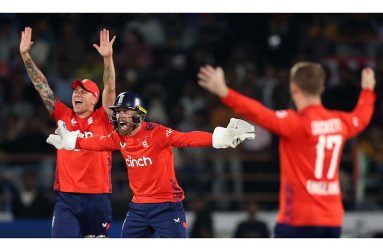 England players celebrate the fall of a wicket