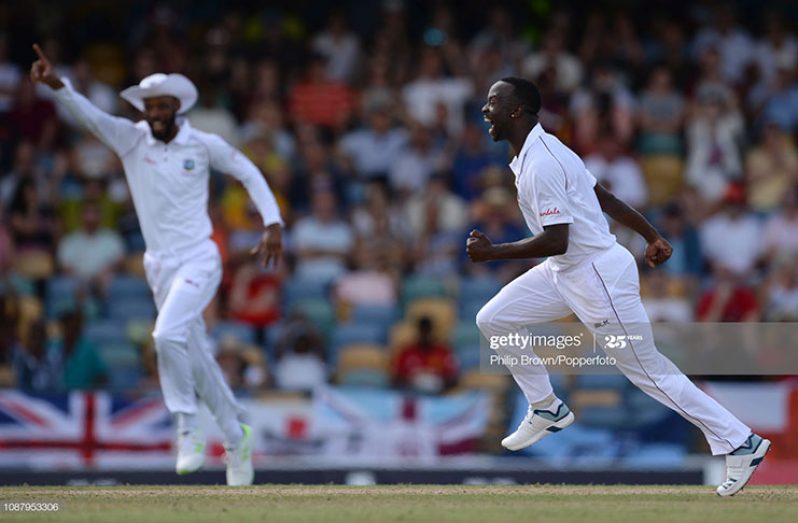 Kemar Roach of the West Indies celebrates after dismissing Jos Buttler of England