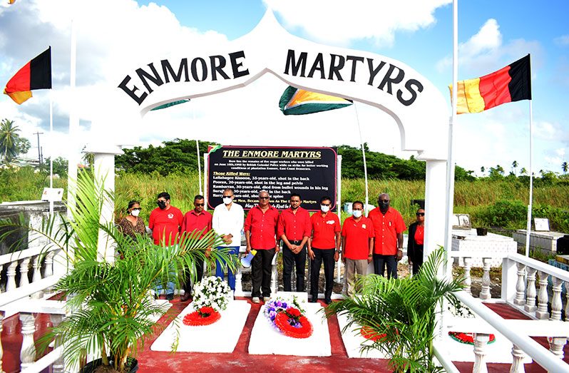 Health Minister Dr. Frank Anthony (fourth left) and Minister of Local Government and Regional Development Nigel Dharamlall (sixth left) along with members of the Guyana Agricultural and General Workers’ Union (GAWU) at Thursday’s wreath-laying ceremony