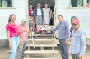 Director General of the Ministry of Agriculture Madanlall Ramraj handing over the tiller