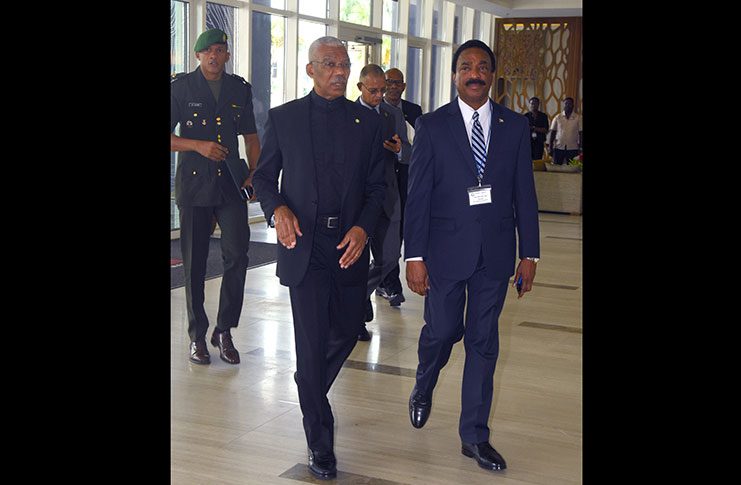 Attorney General Basil Williams S.C. escorts President David Granger into the Marriott Hotel for the opening ceremony of the 46th Plenary and Working Group Meetings of CFATF on Wednesday