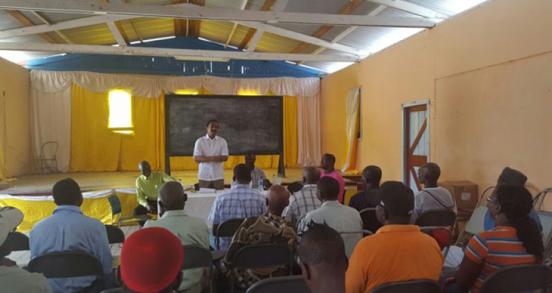 Attorney-General and Minister of Legal Affairs Basil Williams speaking over the weekend to residents on the Essequibo Coast