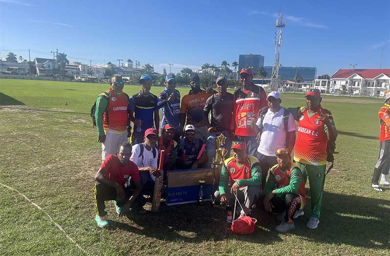 The victorious Essequibo Masters players pose with their winnings