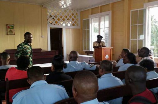 Commander Stephen Mansell  [at the podium] addressing ranks on the launch of the Career Day Fair