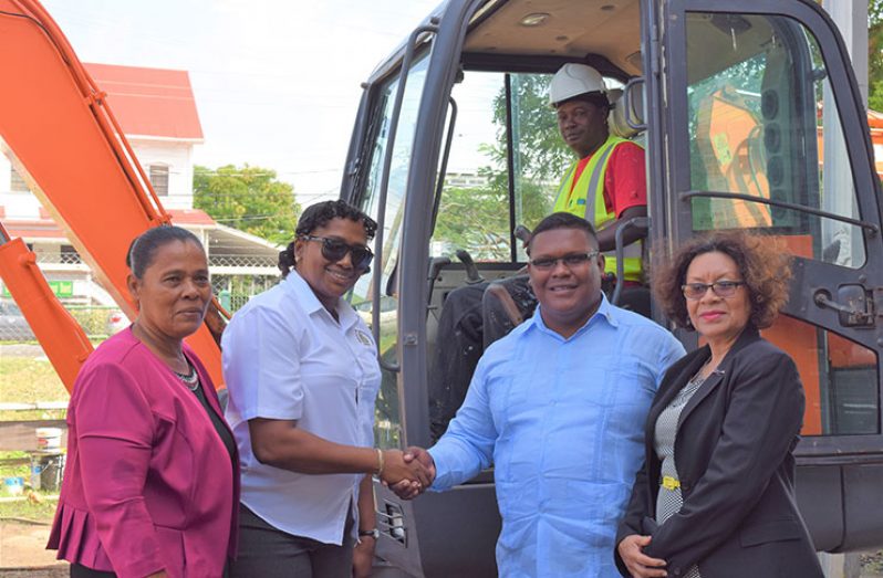 Minister within the Ministry of Public Infrastructure, Annette Ferguson (second left) officially hands over the mini excavator to Region One Chairman, Brentnol Ashley as Minister within the Ministry of Indigenous Peoples’ Affairs, Valerie Garrido-Lowe (right) and Chairperson of the Matthews Ridge/Arakaka and Port Kaituma NDC, Margaret Lambert (left) look on