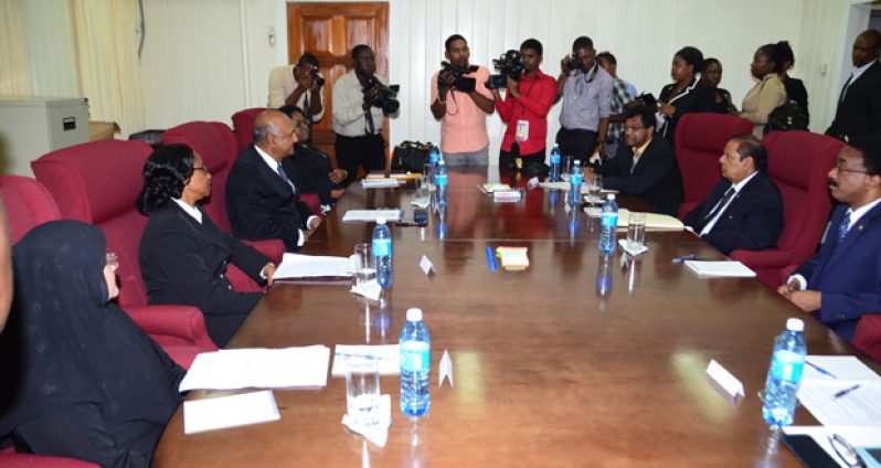 (Right side of the table) Representatives of the Executive arm of Government, Minister of Public Security Khemraj Ramjattan, Prime Minister Moses Nagamootoo and Attorney General Basil Williams seated on the right engage senior members of the Judiciary on the left which includes, Chief Magistrate, Ann Mc Lennan, Chancellor Carl Singh, Chief Justice, Yonette Cummings-Edwards and Director of Public Prosecutions Shalimar Ali-Hack as members of the media look on during a photo opportunity.