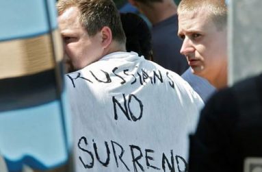 Russian soccer fans suspected of being involved in clashes - one wearing a banner saying ‘Russians No Surrender’ - are ushered off their bus after being stopped by gendarmes in Mandelieu near Cannes in southern France, June 14, 2016. (REUTERS/ERIC GAILLARD)