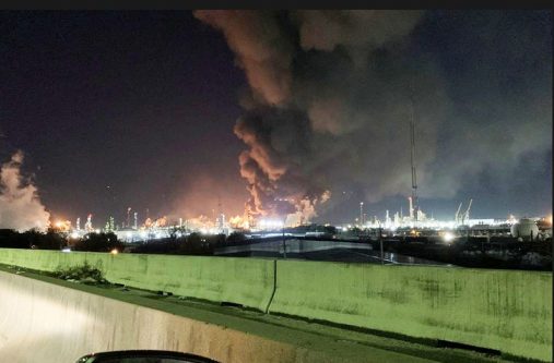 View from the road of a fire at petrochemical company ExxonMobil's refinery near Houston in Baytown, Texas, U.S., December 23, 2021 in this image obtained from social media (Molly Fitzpatrick via REUTERS)