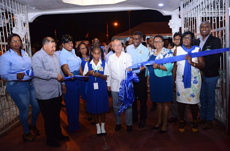 Ministers and other officials cut the ceremonial ribbon to declare the expo opened (Samuel Maughn photo)