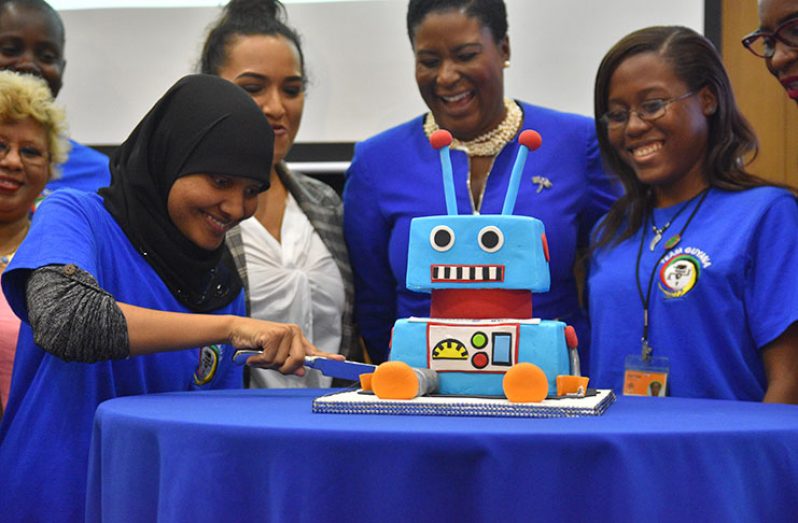 Women in Science, Technology, Engineering and Mathematics (STEM) cut the Innov8 cake to commemorate International Women’s Day which will be observed on March 8 (Samuel Maughn photo)