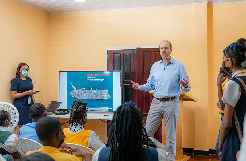 ExxonMobil Production Manager Mike Ryan giving an overview of ExxonMobil’s operations in Guyana to more than 70 students of participating schools (ExxonMobil photo)